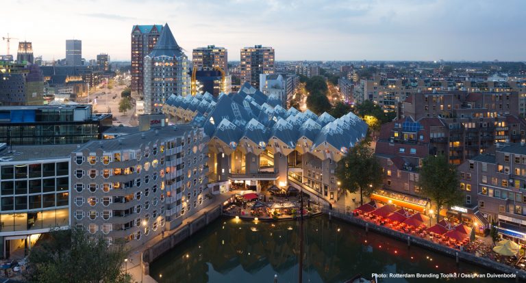 The Oude Haven with in the middle of the cube houses. In the background the Blaaktower also nicknamed the Pencil Building. Right on the waterfront terraces.