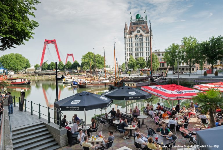 Terrace at the Oude Haven, the oldest port in the center of Rotterdam. In the background, the White House, at its completion in 1898, the tallest office building in Europe.