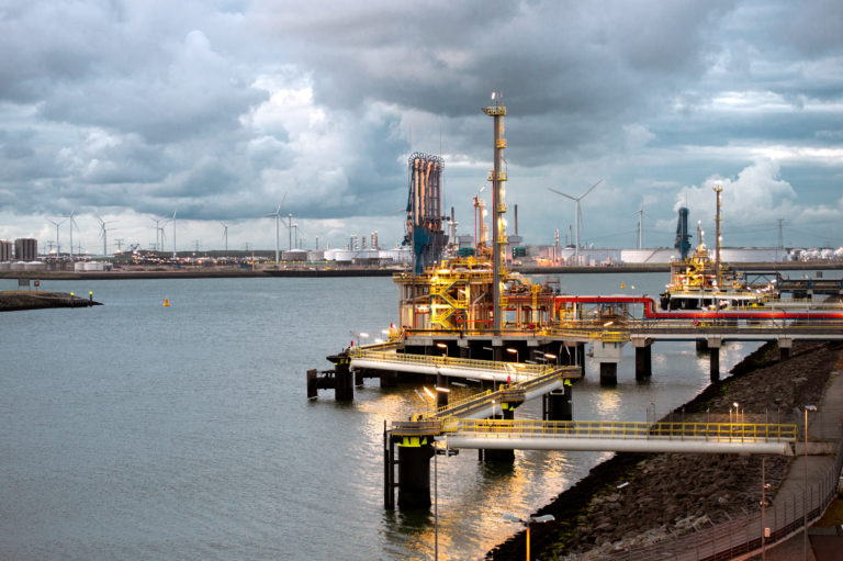 Gate LNG terminal at Nijlhaven, the end of Maasvlakte, overlooking the silos and windmills at Tennesseehaven.
